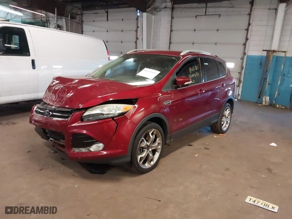 2014 Ford Escape Titanium with VIN 1FMCU9JX5EUC14849, listed as a IAAI auction lot 41635523 with 141,591 mi miles. Bid and sale history available at carsss.com. Image 2.