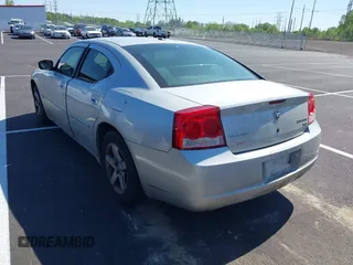 2010 Dodge Charger SXT with VIN 2B3CA3CV4AH253226, listed as a IAAI auction lot 42031664 with 173,785 mi miles. Bid and sale history available at carsss.com. Image 3.