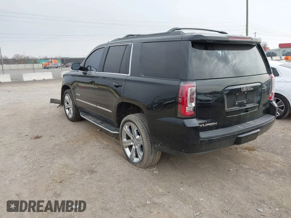 2016 GMC Yukon SLT with VIN 1GKS1BKC3GR272738, listed as a IAAI auction lot 41712439 with 169,726 mi miles. Bid and sale history available at carsss.com. Image 3.