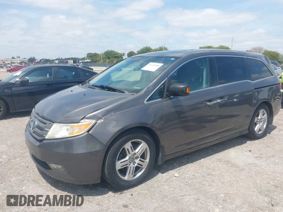 2012 Honda Odyssey Touring with VIN 5FNRL5H90CB088536, listed as a IAAI auction lot 42102008 with 283,350 mi miles and . Bid and sale history available at DreamBid. Image 17.