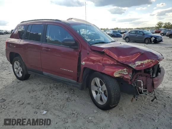 2011 Jeep Compass with VIN 1J4NT1FB4BD194839, listed as a Copart auction lot 73001014 with 113,050 mi miles and Salvage Title. Bid and sale history available at carsss.com. Image 4.