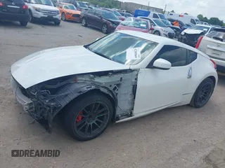 2012 Nissan 370Z z VIN JN1AZ4EH5CM564517, wystawiony jako IAAI lot #42385869 z przebiegiem 55 359 mil mil oraz . Historia ofert i sprzedaży dostępna na DreamBid. Obrazek 18.