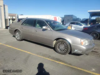 2003 Cadillac DeVille DHS with VIN 1G6KE57Y43U135615, listed as a Copart auction lot 76425404 with 169,505 mi miles and Clean Title. Bid and sale history available at carsss.com. Image 4.