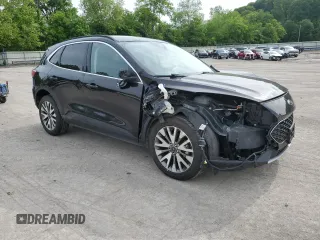 2021 Ford Escape Titanium with VIN 1FMCU9J97MUA57521, listed as a Copart auction lot 58714055 with 83,201 mi miles and Salvage title. Bid and sale history available at DreamBid. Image 4.