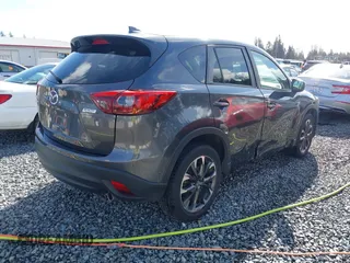 2016 Mazda CX-5 Grand Touring with VIN JM3KE4DY9G0895006, listed as a IAAI auction lot 41703146 with 39,359 mi miles. Bid and sale history available at carsss.com. Image 4.