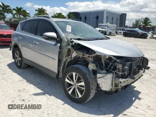 2018 Toyota RAV4 XLE with VIN 2T3WFREV7JW423768, listed as a Copart auction lot 61841875 with 111,991 mi miles and Salvage title. Bid and sale history available at DreamBid. Image 4.