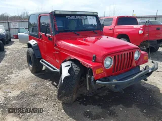 2002 Jeep Wrangler Sport with VIN 1J4FA49S42P771262, listed as a IAAI auction lot 41819403 with 132,871 mi miles. Bid and sale history available at carsss.com. Image 1.