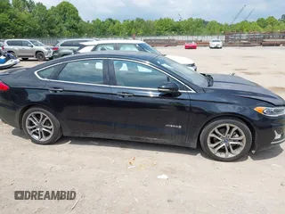 2019 Ford Fusion Titanium z VIN 3FA6P0RU0KR260239, wystawiony jako IAAI lot #42436643 z przebiegiem 114 631 mil mil oraz . Historia ofert i sprzedaży dostępna na DreamBid. Obrazek 13.