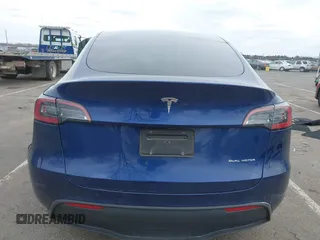 2022 Tesla Model Y Long Range with VIN 7SAYGDEE1NF329909, listed as a IAAI auction lot 41628643 with 32,824 mi miles. Bid and sale history available at carsss.com. Image 16.