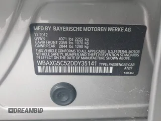 2013 BMW 5 Series 528i with VIN WBAXG5C52DDY35141, listed as a IAAI auction lot 41883031 with 112,917 mi miles and . Bid and sale history available at carsss.com. Image 9.