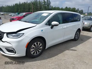 2023 Chrysler Pacifica Hybrid Touring L with VIN 2C4RC1L77PR541513, listed as a IAAI auction lot 42433421 with 53,979 mi miles and . Bid and sale history available at DreamBid. Image 18.