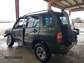 2000 Suzuki Vitara JLS z VIN 2S3TE52VXY6110157, wystawiony jako Copart lot #79173714 z przebiegiem 165 283 mil mil oraz Nie do naprawy. Historia ofert i sprzedaży dostępna na DreamBid. Obrazek 2.