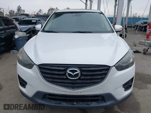 2016 Mazda CX-5 Grand Touring with VIN JM3KE4DY7G0737232, listed as a IAAI auction lot 42158279 with Not Provided miles and . Bid and sale history available at DreamBid. Image 12.