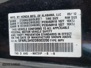 2013 Honda Odyssey Touring with VIN 5FNRL5H92DB003200, listed as a IAAI auction lot 41920237 with 167,483 mi miles. Bid and sale history available at carsss.com. Image 9.