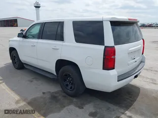 2020 Chevrolet Tahoe Commercial with VIN 1GNSKDEC9LR260983, listed as a IAAI auction lot 42062097 with 124,911 mi miles. Bid and sale history available at carsss.com. Image 3.