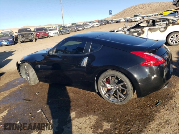 2014 Nissan 370Z Nismo z VIN JN1AZ4EHXEM632166, wystawiony jako Copart lot #88311915 z przebiegiem 18 414 mil mil oraz Szkoda całkowita • Salvage title. Historia ofert i sprzedaży dostępna na DreamBid. Obrazek 2.