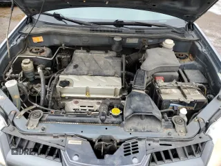 2005 Mitsubishi Outlander z VIN JA4LZ41F75U601526, wystawiony jako Copart lot #50974665 z przebiegiem 265 611 mil mil oraz Szkoda całkowita • Salvage title. Historia ofert i sprzedaży dostępna na DreamBid. Obrazek 12.