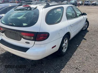2003 Ford Taurus SE Standard z VIN 1FAFP58283A155067, wystawiony jako Copart lot #54555045 z przebiegiem 159 296 mil mil oraz Tytuł czysty. Historia ofert i sprzedaży dostępna na DreamBid. Obrazek 4.