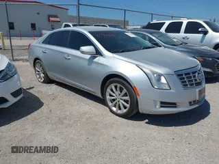 2013 Cadillac XTS Luxury z VIN 2G61P5S30D9219852, wystawiony jako IAAI lot #42794463 z przebiegiem 183 032 mil mil oraz . Historia ofert i sprzedaży dostępna na DreamBid. Obrazek 1.