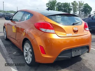 2013 Hyundai Veloster w/Black Int z VIN KMHTC6AD4DU169568, wystawiony jako IAAI lot #42483730 z przebiegiem 214 625 mil mil oraz . Historia ofert i sprzedaży dostępna na DreamBid. Obrazek 3.