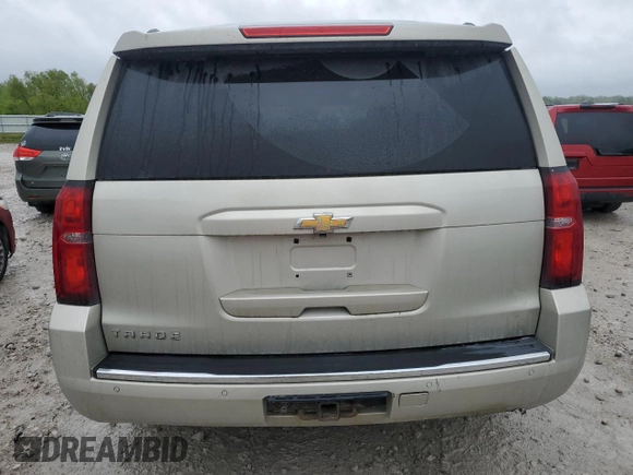 2015 Chevrolet Tahoe LTZ z VIN 1GNSKCKC5FR100084, wystawiony jako Copart lot #57677825 z przebiegiem 141 987 mil mil oraz Czysty tytuł • Clean title. Historia ofert i sprzedaży dostępna na DreamBid. Obrazek 6.