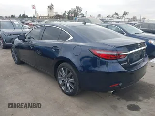 2018 Mazda 6 Grand Touring with VIN JM1GL1TY3J1334600, listed as a IAAI auction lot 41060893 with 64,852 mi miles and . Bid and sale history available at DreamBid. Image 3.