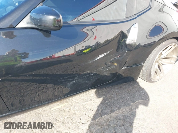 2013 Nissan 370Z z VIN JN1AZ4EH1DM880739, wystawiony jako IAAI lot #40474120 z przebiegiem 76 369 mil mil oraz . Historia ofert i sprzedaży dostępna na DreamBid. Obrazek 6.