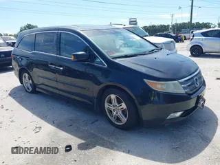2011 Honda Odyssey Touring with VIN 5FNRL5H94BB508457, listed as a IAAI auction lot 42607918 with 490,827 mi miles and . Bid and sale history available at DreamBid. Image 1.