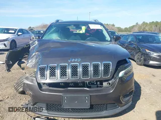 2019 Jeep Cherokee Latitude Plus with VIN 1C4PJMLB3KD424994, listed as a IAAI auction lot 41506691 with 87,912 mi miles and . Bid and sale history available at DreamBid. Image 12.