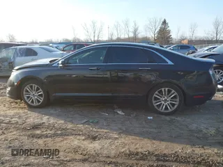 2015 Lincoln MKZ z VIN 3LN6L2J96FR619104, wystawiony jako IAAI lot #41794707 z przebiegiem 140 899 mil mil oraz . Historia ofert i sprzedaży dostępna na DreamBid. Obrazek 14.