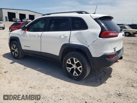 2016 Jeep Cherokee Trailhawk with VIN 1C4PJMBS3GW102000, listed as a Copart auction lot 60866505 with 120,985 mi miles and Salvage title. Bid and sale history available at DreamBid. Image 2.