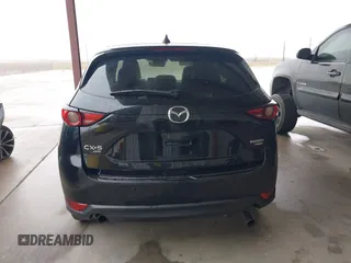 2021 Mazda CX-5 Signature with VIN JM3KFBEY5M0432033, listed as a IAAI auction lot 41607215 with 49,870 mi miles. Bid and sale history available at carsss.com. Image 16.