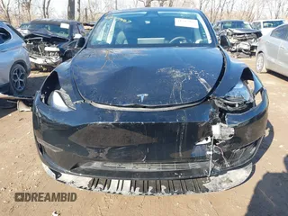 2024 Tesla Model Y with VIN 7SAYGDED5RF093018, listed as a IAAI auction lot 41747467 with 60,469 mi miles and . Bid and sale history available at DreamBid. Image 12.