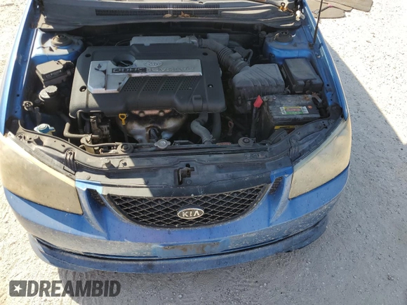 2005 Kia Spectra with VIN KNAFE161555082073, listed as a Copart auction lot 77062804 with 173,387 mi miles and Salvage Title. Bid and sale history available at DreamBid. Image 11.