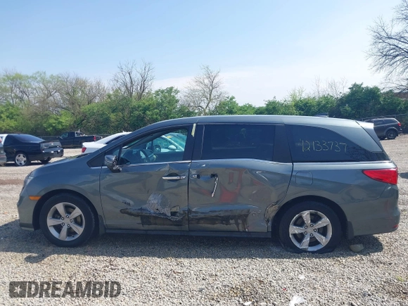 2018 Honda Odyssey EX-L z VIN 5FNRL6H77JB096733, wystawiony jako IAAI lot #42133737 z przebiegiem 165 069 mil mil oraz . Historia ofert i sprzedaży dostępna na DreamBid. Obrazek 14.