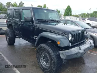 2015 Jeep Wrangler Unlimited Willys Wheeler with VIN 1C4BJWDG4FL687829, listed as a IAAI auction lot 42099147 with 98,969 mi miles and . Bid and sale history available at DreamBid. Image 1.