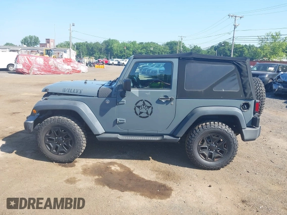 2015 Jeep Wrangler Freedom Edition with VIN 1C4AJWAG1FL714002, listed as a IAAI auction lot 42579024 with 98,732 mi miles and . Bid and sale history available at DreamBid. Image 14.