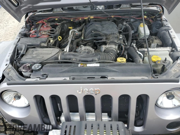 2013 Jeep Wrangler Unlimited Rubicon with VIN 1C4BJWFG5DL661282, listed as a Copart auction lot 57471035 with 128,400 mi miles and Salvage title. Bid and sale history available at DreamBid. Image 12.