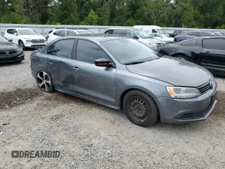 2014 Volkswagen Jetta S with VIN 3VW2K7AJ8EM231099, listed as a Copart auction lot 65752605 with 143,010 mi miles and Salvage title. Bid and sale history available at DreamBid. Image 4.