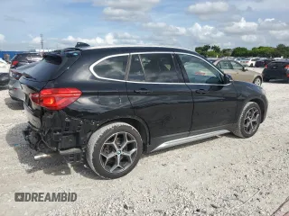 2019 BMW X1 xDrive28i with VIN WBXHT3C59K5L36435, listed as a Copart auction lot 60189985 with 105,110 mi miles and Salvage title. Bid and sale history available at DreamBid. Image 3.