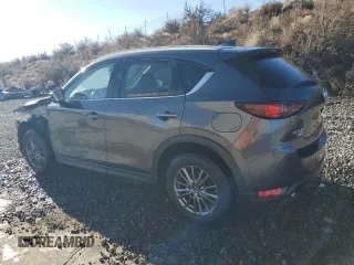2017 Mazda CX-5 Touring with VIN JM3KFBCL2H0204097, listed as a Copart auction lot 88173195 with 76,884 mi miles and Salvage Title. Bid and sale history available at carsss.com. Image 2.