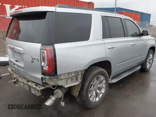 2015 GMC Yukon SLT with VIN 1GKS2BKCXFR131919, listed as a IAAI auction lot 41664827 with 149,398 mi miles. Bid and sale history available at carsss.com. Image 4.
