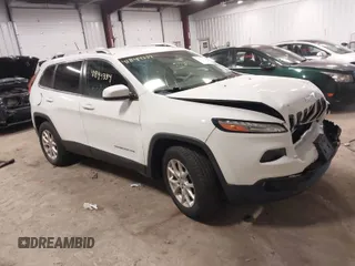 2015 Jeep Cherokee Latitude with VIN 1C4PJMCBXFW773838, listed as a IAAI auction lot 41844334 with 127,556 mi miles. Bid and sale history available at carsss.com. Image 1.