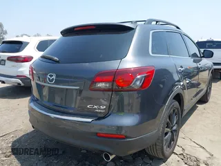2015 Mazda CX-9 Grand Touring with VIN JM3TB3DA0F0459024, listed as a IAAI auction lot 42452288 with 174,716 mi miles and . Bid and sale history available at DreamBid. Image 4.