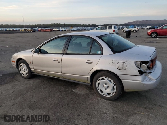 2001 Saturn SL z VIN 1G8ZK52761Z204012, wystawiony jako Copart lot #86618384 z przebiegiem 99 674 mil mil oraz Szkoda całkowita • Salvage title. Historia ofert i sprzedaży dostępna na DreamBid. Obrazek 2.