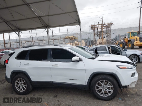 2015 Jeep Cherokee Latitude with VIN 1C4PJLCB5FW642701, listed as a IAAI auction lot 42063262 with 142,501 mi miles and . Bid and sale history available at carsss.com. Image 13.