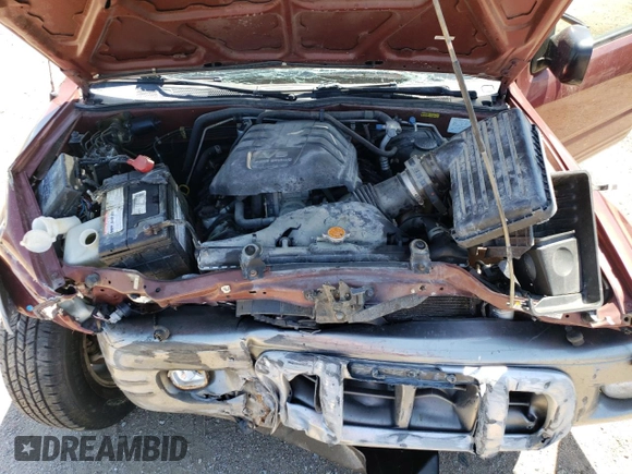 2002 Isuzu Rodeo z VIN 4S2CK57W324328446, wystawiony jako Copart lot #58097174 z przebiegiem 118 514 mil mil oraz Szkoda całkowita • Salvage title. Historia ofert i sprzedaży dostępna na DreamBid. Obrazek 13.