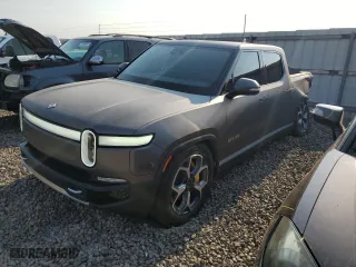 2023 Rivian R1T Adventure with VIN 7FCTGAAA5PN023738, listed as a Copart auction lot 63131724 with 141 mi miles and Salvage Title. Bid and sale history available at carsss.com. Image 1.