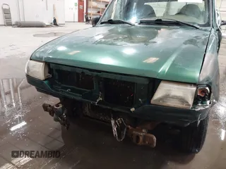 1999 Mazda B-Series Truck SE z VIN 4F4YR16C0XTM43278, wystawiony jako IAAI lot #41687429 z przebiegiem 288 858 mil mil oraz . Historia ofert i sprzedaży dostępna na DreamBid. Obrazek 6.