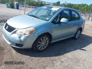 2009 Suzuki SX4 Sport FWD z VIN JS2YC414496204125, wystawiony jako IAAI lot #42384599 z przebiegiem 154 759 mil mil oraz . Historia ofert i sprzedaży dostępna na DreamBid. Obrazek 2.